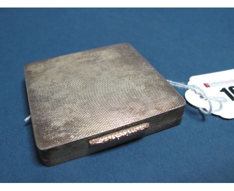 A Hallmarked Silver Powder Compact, L E McCann, Birmingham 1944, also engraved "Dunhill London", of square form allover engin