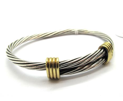 Tiffany &amp; Co; A Hallmarked Silver Expanding Bangle, of ropetwist design, with 18ct gold four row highlights. 