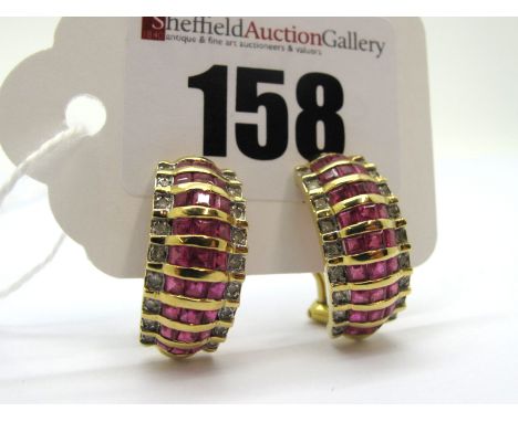 A Pair of Modern Ruby and Diamond Set Earrings, on Continental style hinged back fittings, stamped "750".