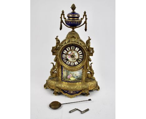 A good 19th Century French ormolu and porcelain mantel clock circa 1880's, 8 day movement striking on a bell, with pendulum a