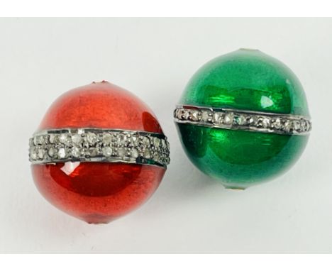 Two enamel and diamond beads, one in red the other green. Diamonds 0.50ct total