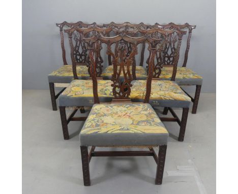 A set of six antique mahogany and needlepoint upholstered Chippendale style dining chairs, with carved and pierced decoration