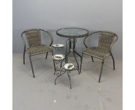 A circular glass top garden table and two matching chairs, and a painted metal folding three-tier mosaic-top plant stand.