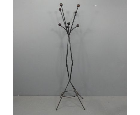 A mid-century atomic hat and coat stand in the manner of Roger Feraud, with wooden ball ends on wrought metal frame. Height 1