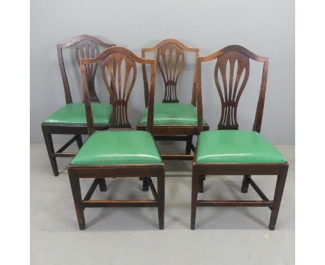 A set of four country Elm Chippendale style dining chairs reupholstered in green leather with drop-in seats.