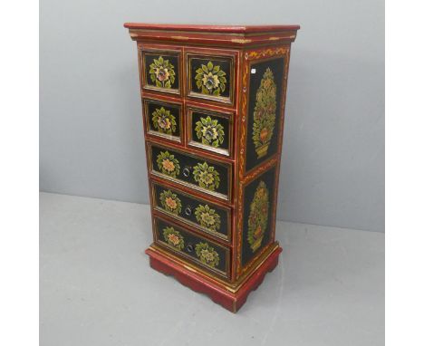 A modern folk-art painted eastern European style narrow chest of seven drawers. Width 49cm, height 103cm, depth 36cm.