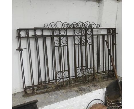 A pair of painted wrought iron gates, and another.Each of the pair of gates measures 165cm in length (including hinge) and 10