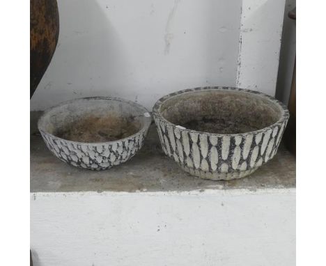 Two similar composite garden bowl ornaments. Largest diameter 34cm, height 16cm.