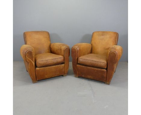 A pair of vintage French leather-upholstered club arm chairs. Some marks and abrasions to leather. Some cracking also. Stains
