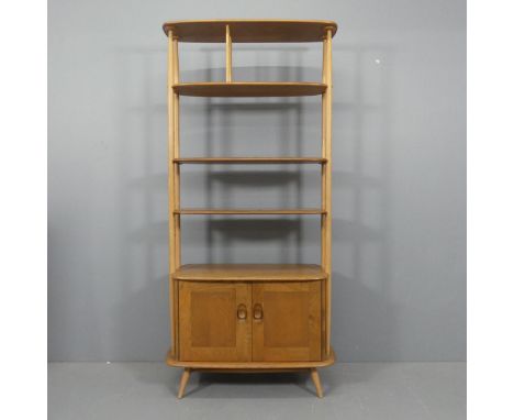 ERCOL - An elm and beech "Giraffe" bookcase / room divider, with adjustable shelves and cupboards under. Width 88cm, height 1