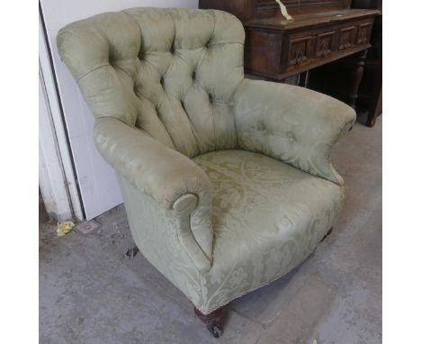 A Victorian oak and button-back upholstered lounge chair.