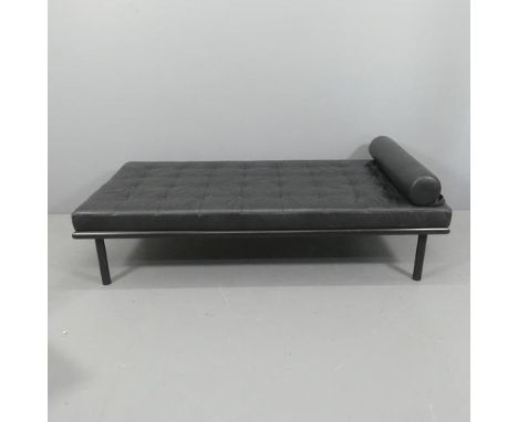 A contemporary black leather upholstered daybed on metal frame, in the manner of Jean Prouvé. Length 183cm, height 42cm, widt