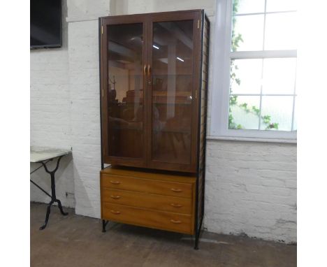 A modular Ladderax display cabinet, the upper section having two glazed panelled doors and four adjustable glass shelves and 