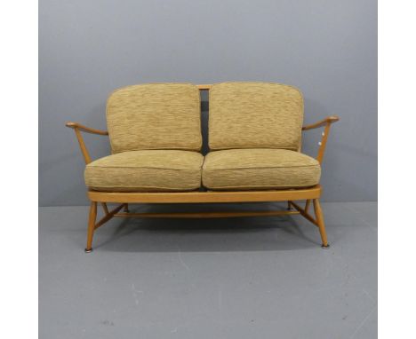 ERCOL - A mid-century design beech model 204 two-seater sofa, with upholstered cushions and gold maker's label. Overall width