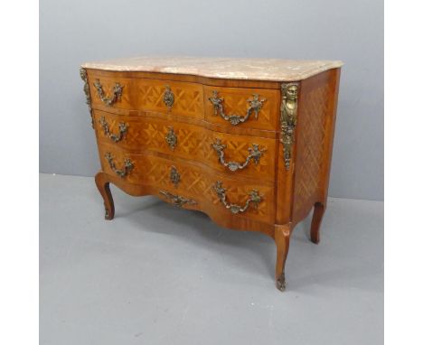 A French marble topped and walnut parquetry veneered Louis XV style commode of shaped form, with figural and rococo brass mou