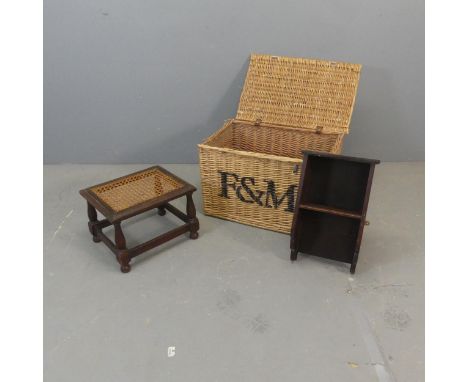 A Fortnum &amp; Mason's wicker hamper, width 56cm, height 31cm, depth 38cm, a hanging shelf and a cane panelled footstool. (3