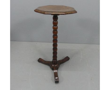 A 19th century burr-walnut veneered octagonal wine table, on mahogany bobbin turned central column with tripod base. Width 36