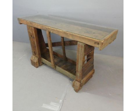 A vintage pine work bench with associated glass top. Width 161cm, height 85cm, depth 52cm.