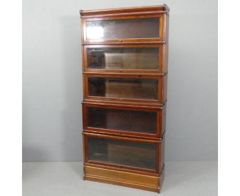 An early 20th century mahogany Globe-Wernicke style five shelf sectional stacking bookcase in seven sections. Overall width 8