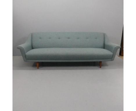A mid-century Danish style sofa raised on teak tapered legs, in the manner of Georg Thams. Overall width 222cm, height 73cm, 