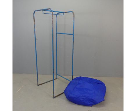 A vintage painted tubular metal shop display rack, with waterproof cover. Width 54cm, height 137cm, depth 46cm.Good used cond