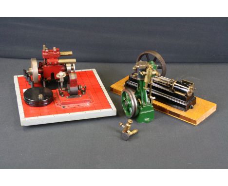 Live Steam - A Stuart horizontal single cylinder mill engine with 3 3/4" spoked flywheel, raised on a wooden base (28.5cm ove