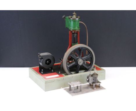 Live Steam - An early 20th century single cylinder vertical engine, circa 1925, with 7 1/4" spoked flywheel, driving a blower