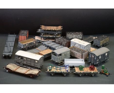 24 O gauge items of kit built rolling stock featuring flatbeds, trucks and vans, plastic &amp; metal constructions, overall v