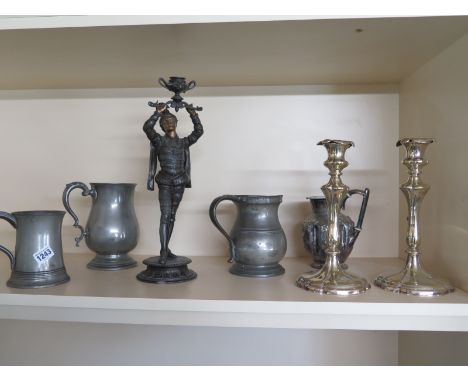 A Spelter candlestick, three Victorian pewter tankards ad a pair of candlesticks Condition report: Require re-painting, some 