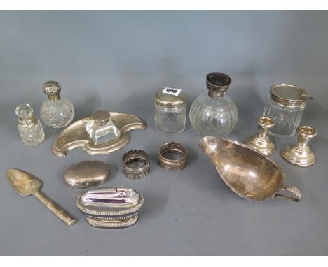 A selection of silver items including a desk stand, weighted candlesticks and a plated lighter and knife - 14 pieces - most w