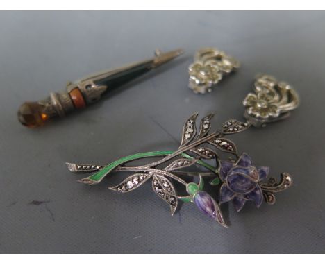 A Continental silver marcasite and enamel brooch of floral form, a pair of white metal floral design earrings and a white met