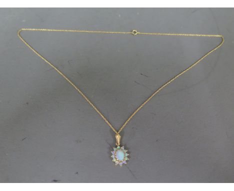 An oval opal pendant on 9ct yellow gold chain - Weight approx. 1.9gms - chain length 46cm Condition report: In clean and brig