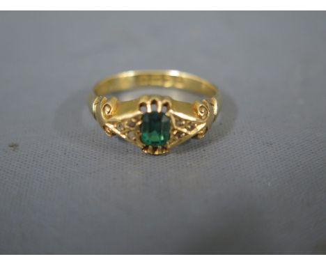 An 18ct yellow gold emerald and diamond ring size Q/R - approx weight 3.2 grams