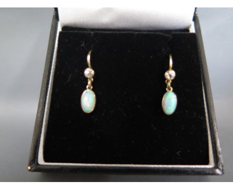 A pair of diamond and opal set earrings - Length approx. 20mm Condition report: Clean condition 