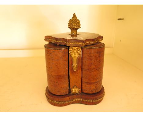 A revolving perfume bottle stand of four perfume bottle compartments, ormolu mounted with ormolu finial - no damage evident
