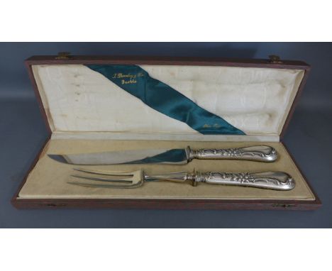 A Continental .800 silver serving knife and fork in presentation case, with foliate embossed decoration - clean and in good c