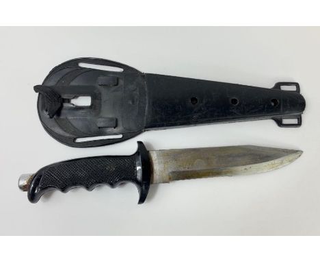 A vintage diver's knife, in a black scabbard 