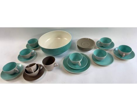 A collection of Poole pottery two tone cups and saucers and a large bowl 