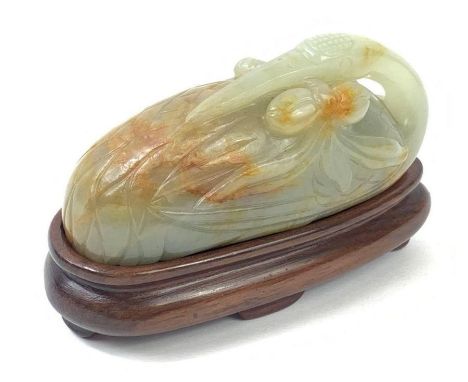 A 19th century Chinese jade carving of a crane, on a fitted wooden stand, 8.2cm long, 3.8cm high 