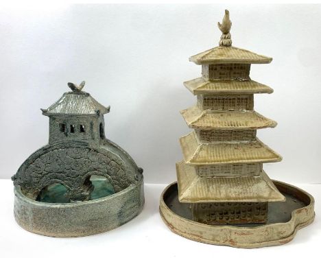Two pieces of Japanese studio pottery, to include a model of a bridge and a pagoda, bearing signatures to the base