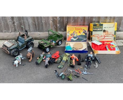 A collection of Action Man figures, cars and other items