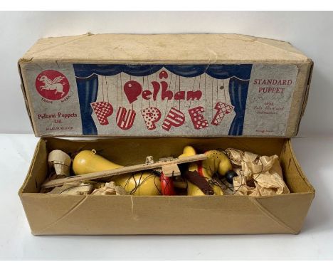 Pelham puppert, a boxed model of Pluto 