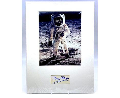 Buzz Aldrin (b. 1930), American former astronaut. Autograph. Signed in bold blue ink mounted with a colour print of Neil Arms