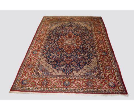 Saruk carpet, north west Persia, mid-20th century, 11ft. 2in. X 7ft. 11in. 3.40m. X 2.41m. Slight wear in places. Mid-blue fi