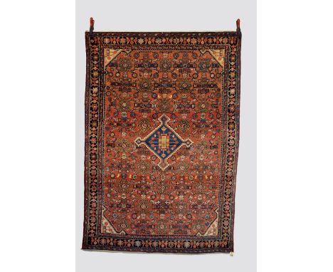 Hamadan rug, north west Persia, circa 1930s-40s, 6ft. 10in. X 4ft. 9in. 2.08m. X 1.45m. Light terracotta field with small pal