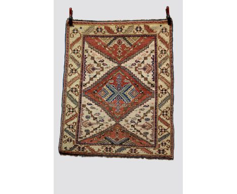 Medallion rug, last quarter 20th century, 4ft. 4in. X 3ft. 6in. 1.32m. X 1.07m. Light red step sided diamond shaped central m