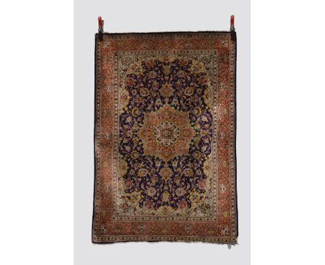 Silk Qum rug, south central Persia, circa 1950s-60s, 5ft. X 3ft. 5in. 1.52m. X 1.04m. Damage/'bite' to lower right corner. Da