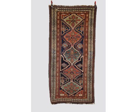 Luri long rug, Luristan, west Persia, late 19th century, 7ft. 10in. X 3ft. 9in. 2.39m. X 1.14m. Overall even wear. Five centr