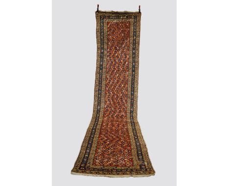 Kurdish 'boteh' runner, north west Persia, early 20th century, 15ft. 4in. X 3ft. 7in. 4.67m. X 1.09m. Some wear in places; sm
