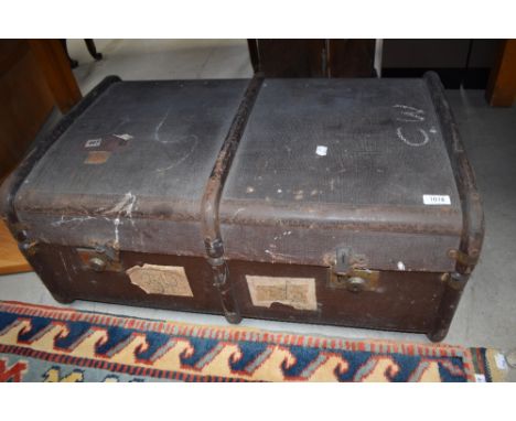 A vintage travel trunk, bearing railway labels etc